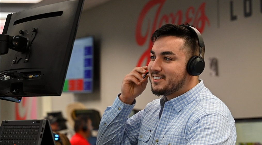 Amado Luna, a member of the Jones Logistics (JoLo) team talks to one of his customers.